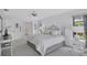Large main bedroom boasts serene decor, ample closet space, and bright, natural light at 4487 Glebe Farm Rd, Sarasota, FL 34235