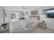 Airy main bedroom featuring a cozy seating area and windows bringing in plenty of natural light at 4487 Glebe Farm Rd, Sarasota, FL 34235