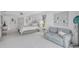 Spacious main bedroom with an elegant sitting area, light walls and carpet, and ample natural light at 4487 Glebe Farm Rd, Sarasota, FL 34235