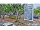 A sign for The Meadows Shopping Village with a list of stores and businesses at 4487 Glebe Farm Rd, Sarasota, FL 34235
