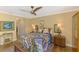 Comfortable bedroom with hardwood floors, a ceiling fan, and stylish furnishings at 4489 Longmeadow # 74, Sarasota, FL 34235