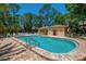 Sparkling community pool with pool house and ample seating for residents' enjoyment at 4489 Longmeadow # 74, Sarasota, FL 34235