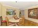 Dining area with an open view of the kitchen and elegant decor, offering a cozy atmosphere at 4489 Longmeadow # 74, Sarasota, FL 34235