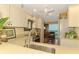 Well-lit kitchen featuring neutral cabinets, modern appliances, and view into office at 4489 Longmeadow # 74, Sarasota, FL 34235