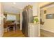 Kitchen with stainless steel refrigerator and breakfast nook/office space at 4489 Longmeadow # 74, Sarasota, FL 34235
