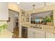 Kitchen view to dishwasher, sink, and view to living room at 4489 Longmeadow # 74, Sarasota, FL 34235