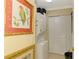 Cozy laundry room featuring a stacked washer and dryer and built-in storage at 4489 Longmeadow # 74, Sarasota, FL 34235