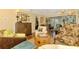 Comfortable living room with stylish decor and access to a screened-in porch with outdoor views at 4489 Longmeadow # 74, Sarasota, FL 34235