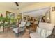 Inviting living room with access to the screened lanai, offering seamless indoor-outdoor living at 4489 Longmeadow # 74, Sarasota, FL 34235