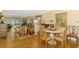 Bright, spacious living room with beautiful hardwood floors, tasteful decor, and plenty of seating at 4489 Longmeadow # 74, Sarasota, FL 34235