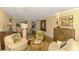 Bright living area featuring hardwood floors and seamless access to dining and living spaces at 4489 Longmeadow # 74, Sarasota, FL 34235
