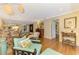 Charming living room with wood floors, ornate furniture, and natural light at 4489 Longmeadow # 74, Sarasota, FL 34235