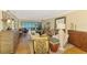 Spacious living room with comfortable seating and access to the screened-in lanai, perfect for relaxing at 4489 Longmeadow # 74, Sarasota, FL 34235
