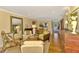 Open-concept living area with hardwood floors and access to other rooms in the home at 4489 Longmeadow # 74, Sarasota, FL 34235