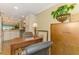 Kitchen view into office space with wooden desk and natural light at 4489 Longmeadow # 74, Sarasota, FL 34235