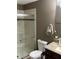 Well-maintained bathroom with a shower, toilet, and vanity with granite countertop at 4622 Grand Lakeside Dr, Palm Harbor, FL 34684