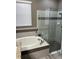 Bathroom featuring a soaking tub and a separate glass shower, offering a spa-like experience at 4622 Grand Lakeside Dr, Palm Harbor, FL 34684