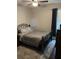 Bedroom with comfortable bed, ceiling fan and natural light creates a cozy and inviting space at 4622 Grand Lakeside Dr, Palm Harbor, FL 34684