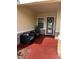 Cozy front porch with stylish seating and a decorative front door wreath at 4622 Grand Lakeside Dr, Palm Harbor, FL 34684