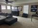 Cozy living room with ample seating, natural light, and sports memorabilia at 4622 Grand Lakeside Dr, Palm Harbor, FL 34684