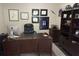 Spacious office with a wooden desk, comfortable chair, and decorative sports memorabilia at 4622 Grand Lakeside Dr, Palm Harbor, FL 34684