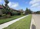 View of the street and the houses at 4622 Grand Lakeside Dr, Palm Harbor, FL 34684