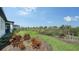 Manicured backyard with lush greenery and well-maintained landscaping, offering a private and serene outdoor space at 4725 Antrim Dr, Sarasota, FL 34240