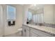 Clean bathroom with granite counters, modern fixtures and natural light from a window at 4725 Antrim Dr, Sarasota, FL 34240