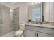 Modern bathroom with a glass shower and granite vanity, offering a sleek and comfortable space at 4725 Antrim Dr, Sarasota, FL 34240