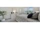 Inviting bedroom with a large dresser, decorative plant, and comfortable bed at 4725 Antrim Dr, Sarasota, FL 34240