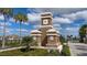 Worthington community entrance monument with palm trees against a cloudy blue sky at 4725 Antrim Dr, Sarasota, FL 34240
