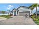 A well-kept home boasting a brick driveway, tidy lawn, and vibrant landscaping at 4725 Antrim Dr, Sarasota, FL 34240