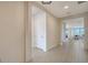 Bright hallway with sleek wood-look floors leads into the beautifully designed living space at 4725 Antrim Dr, Sarasota, FL 34240