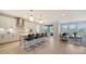 Modern kitchen with island seating, stainless steel appliances, and plenty of natural light at 4725 Antrim Dr, Sarasota, FL 34240