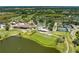 Expansive aerial view of the community amenities including golf course, clubhouse, pool, and tennis courts at 5320 Hyland Hills Ave # 2214, Sarasota, FL 34241