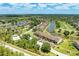 Beautiful aerial view of a condo community, golf course, and lakes on a sunny day at 5320 Hyland Hills Ave # 2214, Sarasota, FL 34241