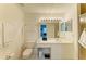 Bathroom featuring a vanity with a large mirror, a toilet, and a walk-in shower at 5320 Hyland Hills Ave # 2214, Sarasota, FL 34241