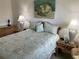 Charming bedroom with rattan furniture and seashell-themed bedding at 5320 Hyland Hills Ave # 2214, Sarasota, FL 34241