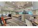 Large conference room featuring ample seating, stylish lighting, and neutral colors, ideal for meetings at 5320 Hyland Hills Ave # 2214, Sarasota, FL 34241