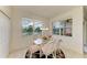 Bright dining area showcases scenic outdoor views and a stylish table setting for delightful meals at 5320 Hyland Hills Ave # 2214, Sarasota, FL 34241