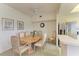 Inviting dining area featuring a round table, comfortable seating, and kitchen views at 5320 Hyland Hills Ave # 2214, Sarasota, FL 34241
