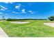 Picturesque golf course featuring lush green fairways, sand traps, and water hazards for golfing enthusiasts at 5320 Hyland Hills Ave # 2214, Sarasota, FL 34241