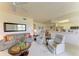 Spacious living room showcases a comfortable setting with a peek into kitchen and dining areas at 5320 Hyland Hills Ave # 2214, Sarasota, FL 34241