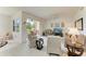 Cozy living room with comfortable seating and sliding glass doors leading to a patio at 5320 Hyland Hills Ave # 2214, Sarasota, FL 34241