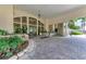 Elegant lobby entrance featuring stone accents, tiled floors, manicured greenery, and architectural details at 5320 Hyland Hills Ave # 2214, Sarasota, FL 34241