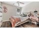 Stylized bedroom with wood-look floors, a window, and a neutral color palette at 5426 Rainwood Meadows Dr, Apollo Beach, FL 33572