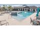 Inviting community pool area with a bar, ample seating, and lush landscaping, perfect for socializing and relaxation at 5426 Rainwood Meadows Dr, Apollo Beach, FL 33572