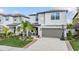 Charming two-story home with well-manicured landscaping and a two-car garage at 5426 Rainwood Meadows Dr, Apollo Beach, FL 33572