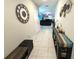 Hallway showcasing a stylish bench and a view into the living room at 5426 Rainwood Meadows Dr, Apollo Beach, FL 33572