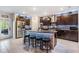 Modern kitchen with a large island, stainless steel appliances, and plenty of storage at 5426 Rainwood Meadows Dr, Apollo Beach, FL 33572